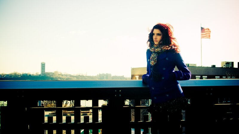 Woman in Blue Coat — Contemplative