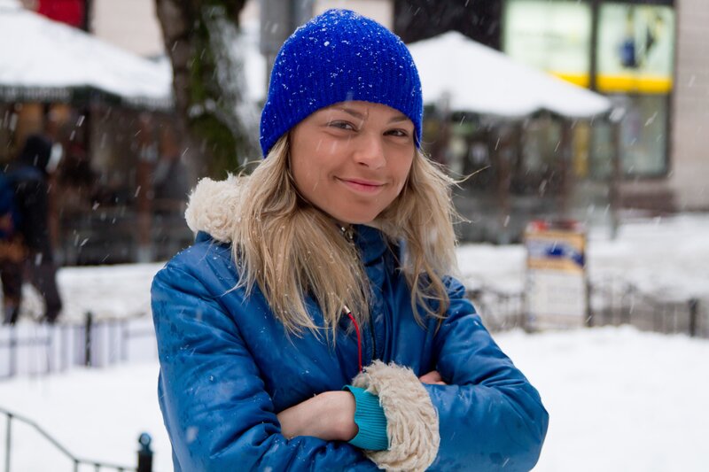 woman in blue coat in snow