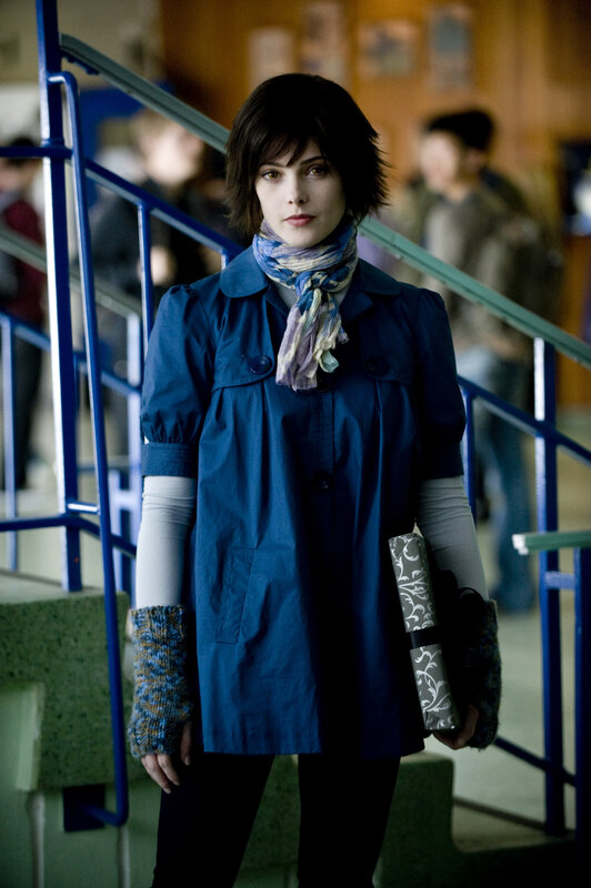 woman in blue coat on stairs