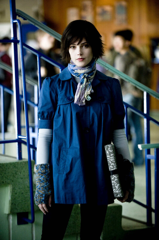 woman in blue coat on stairs