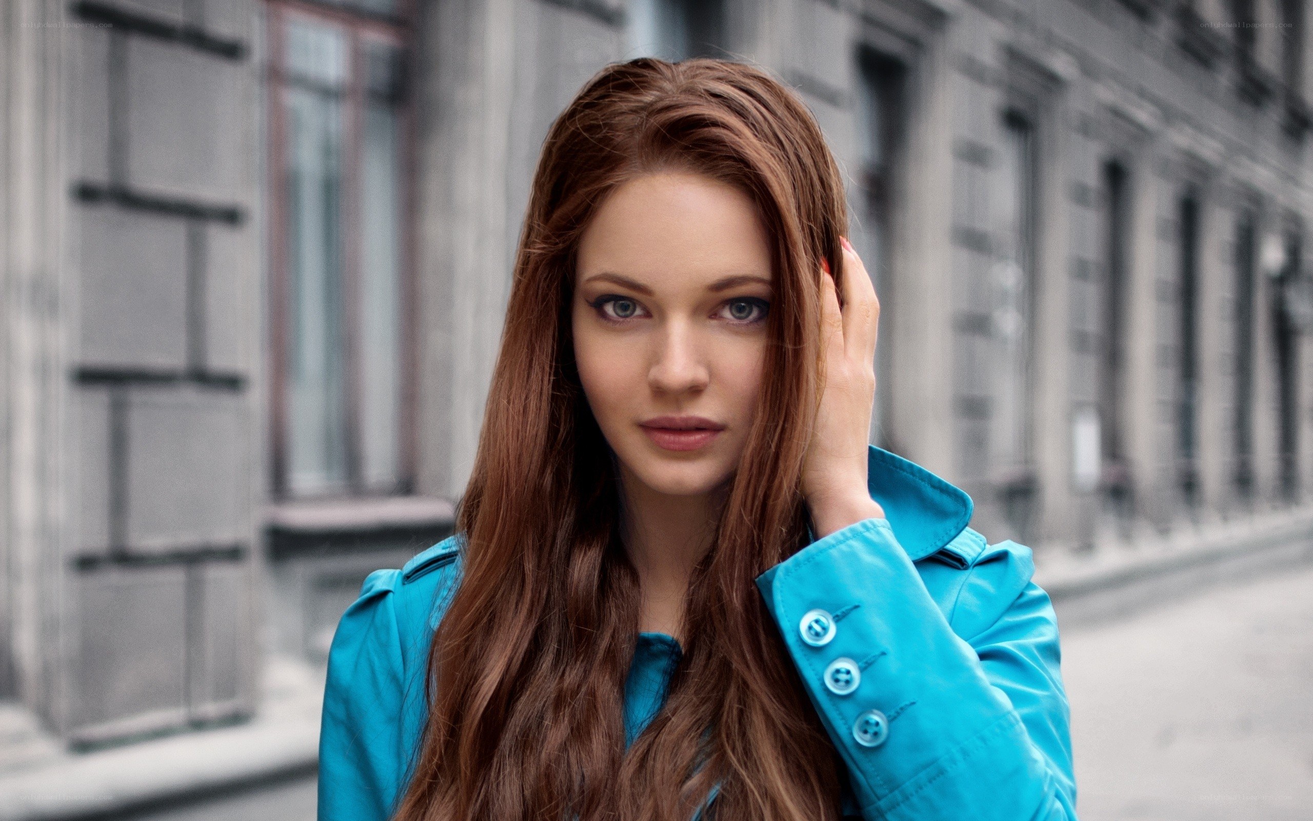 woman in blue coat on street