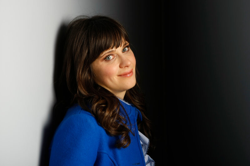 woman in blue coat smiling