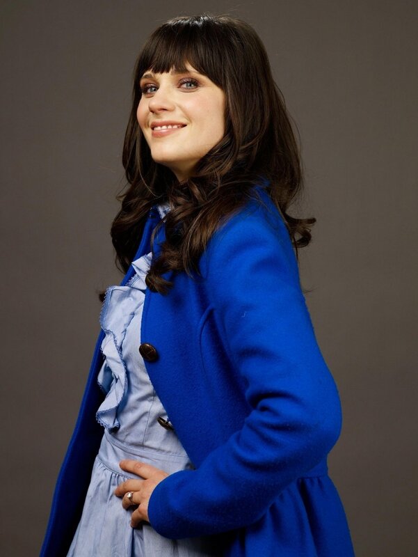 woman in blue coat smiling