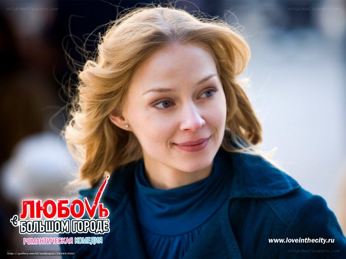 Woman in blue coat smiling