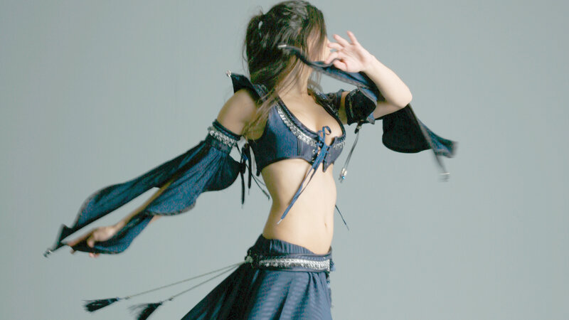woman in blue costume dancing