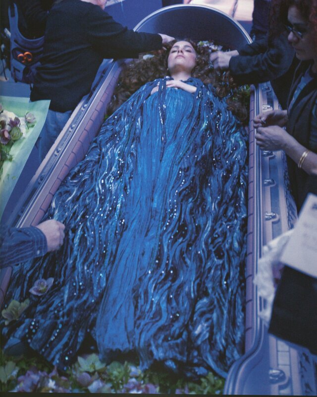 Woman in blue costume on set