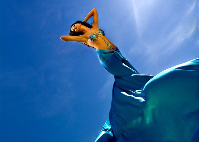 woman in blue dress against sky