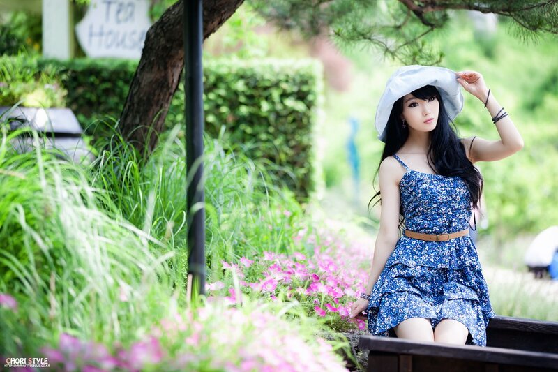 Woman in blue dress at tea house