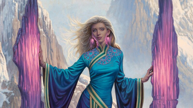 woman in blue dress between crystals