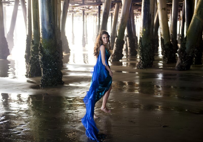 Woman in Blue Dress — Dramatic, Afternoon, Photograph, Beach, Pier