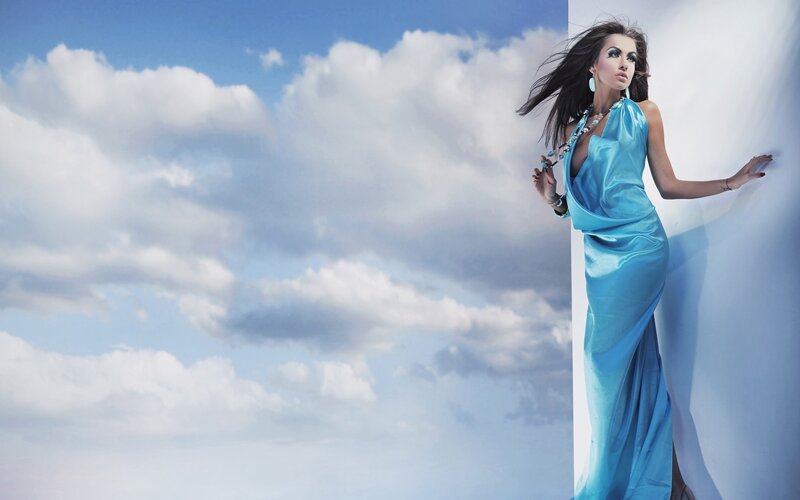 Woman in Blue Dress — Dramatic, Afternoon, Photograph, Clouds