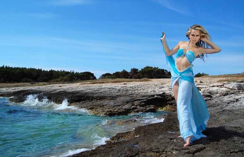 Woman in Blue Dress — Dramatic, Afternoon, Photograph, Rocks