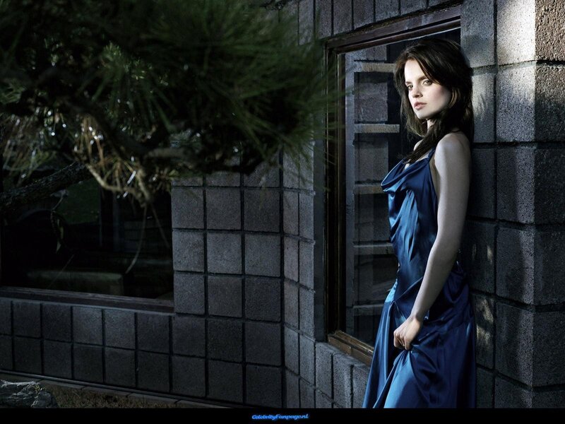 Woman in Blue Dress — Dramatic, Night, Photograph, Brick Wall, Window