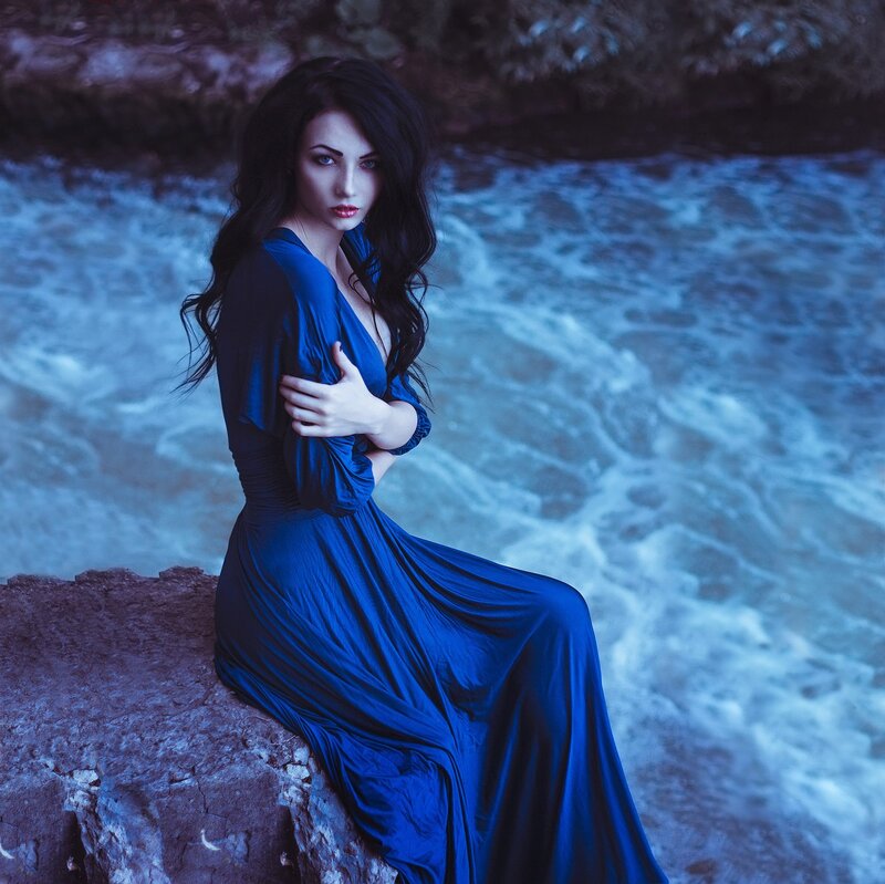 Woman in Blue Dress — Dramatic, Night, Photograph, Rocks