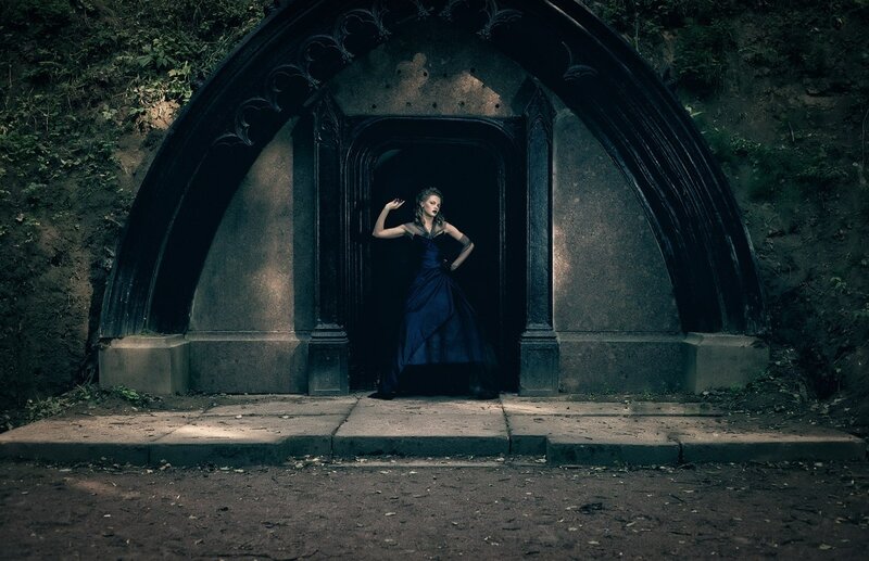 Woman in Blue Dress — Dramatic, Photograph, Archway