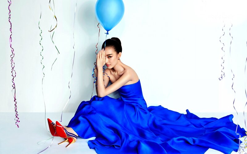 Woman in Blue Dress — Dramatic, Photograph, Balloon