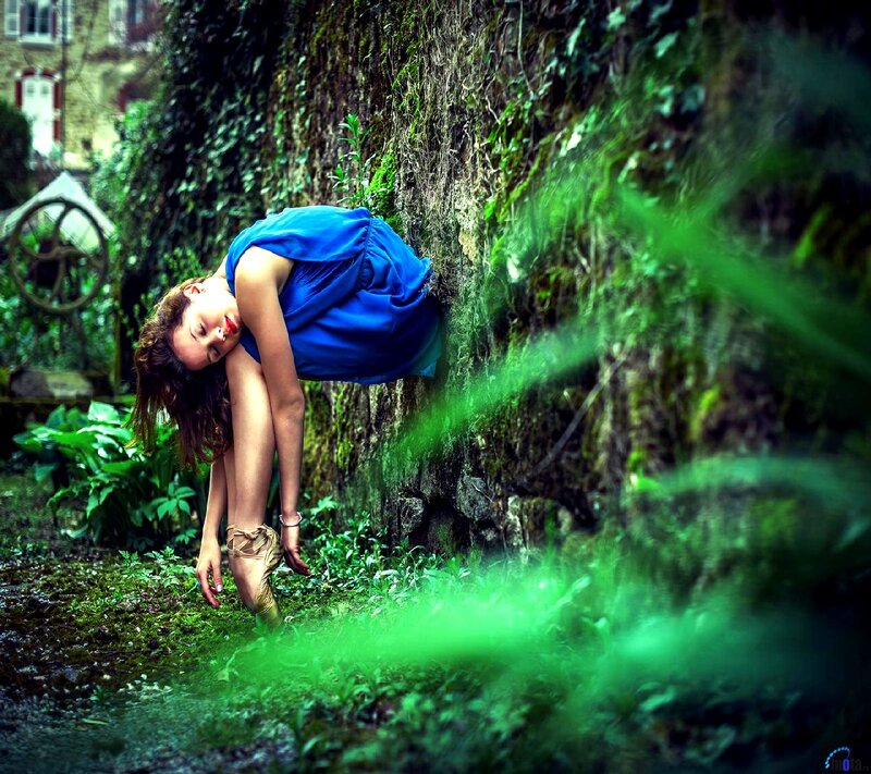 Woman in Blue Dress — Dramatic, Photograph, Mossy Wall