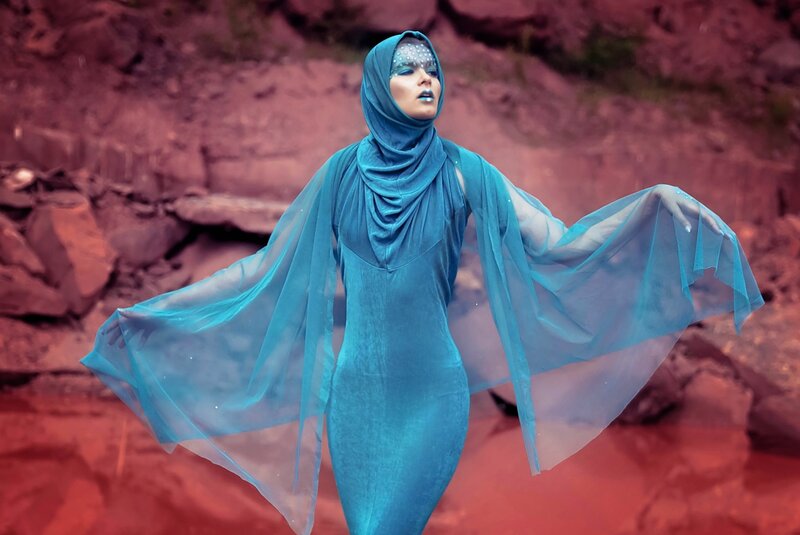 Woman in Blue Dress — Dramatic, Photograph, Rocks, Makeup