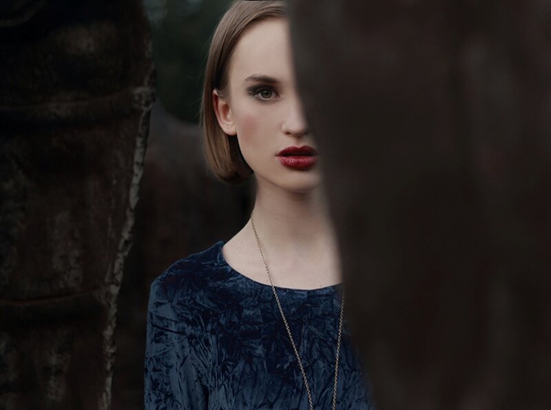 Woman in Blue Dress — Dramatic, Photograph, Stone Structure
