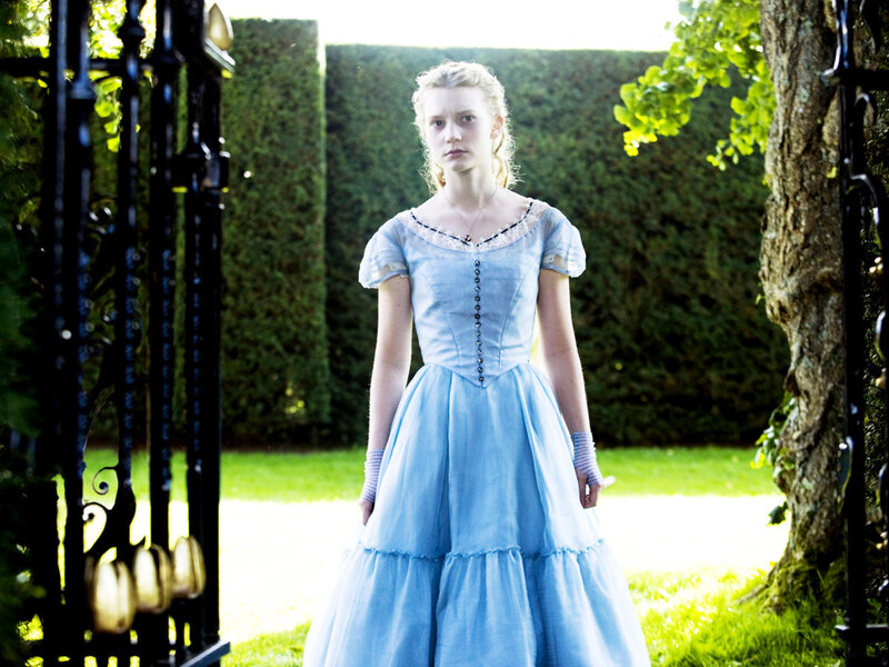 woman in blue dress in garden
