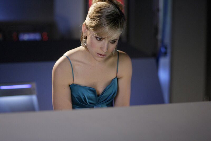 woman in blue dress looking down