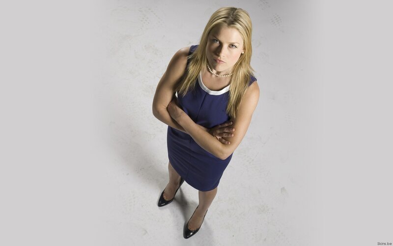 woman in blue dress looking up