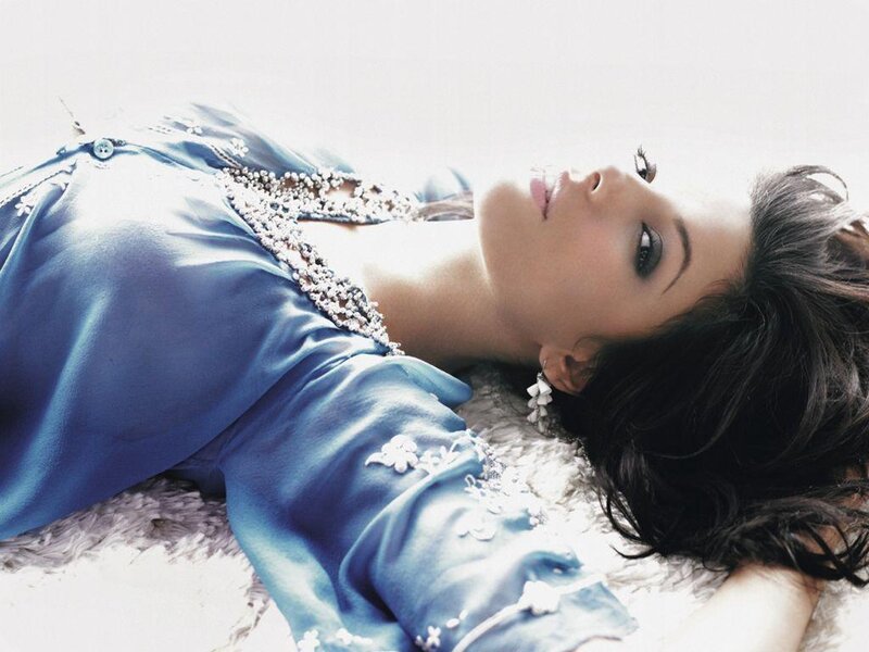 woman in blue dress lying down