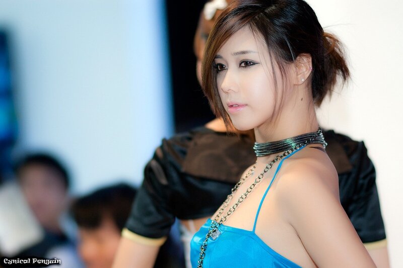 Woman in Blue Dress — Neutral, Photograph, Chain Necklace