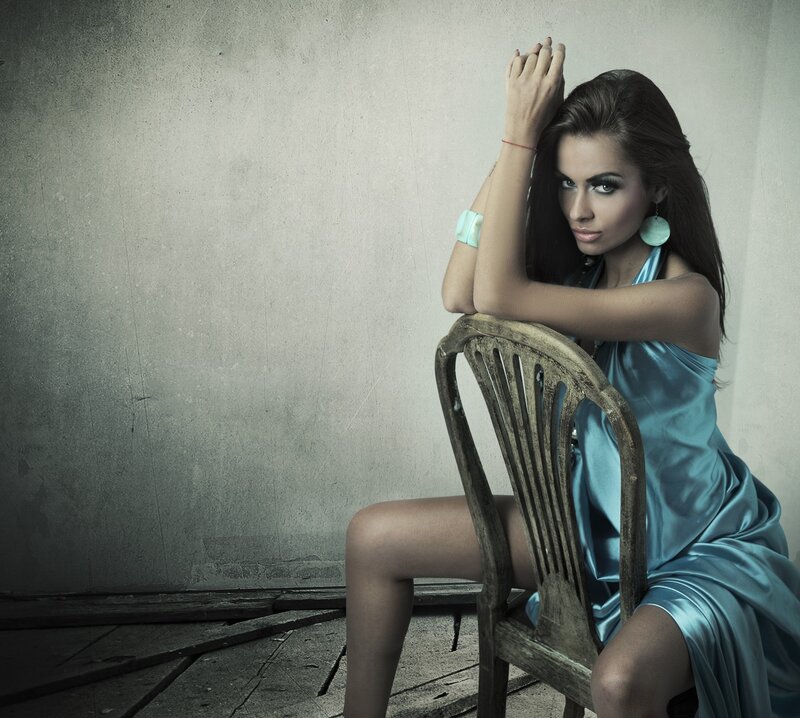 woman in blue dress on chair