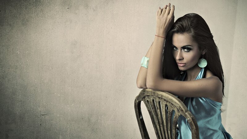 woman in blue dress on chair