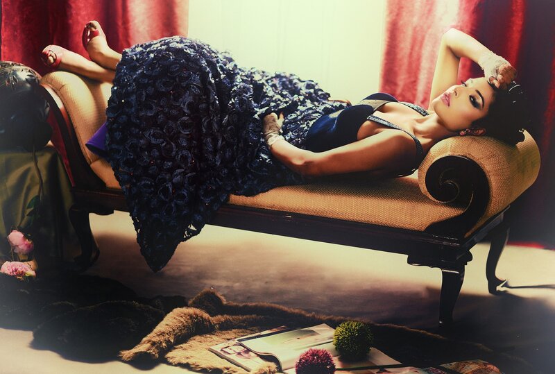 woman in blue dress on chaise lounge
