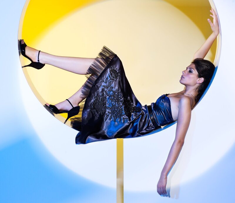 woman in blue dress on circular platform