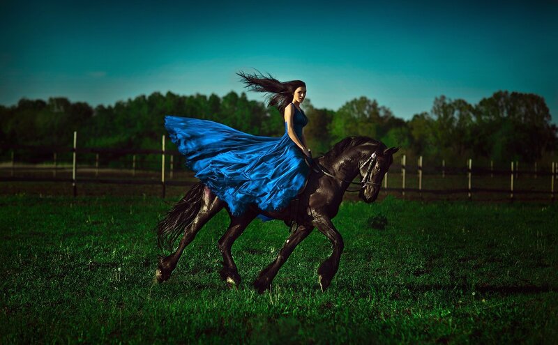 Woman in Blue Dress on Horse