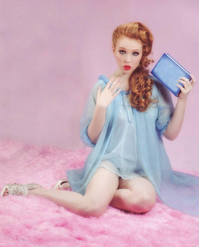 woman in blue dress on pink rug