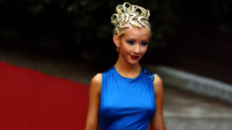 woman in blue dress on red carpet
