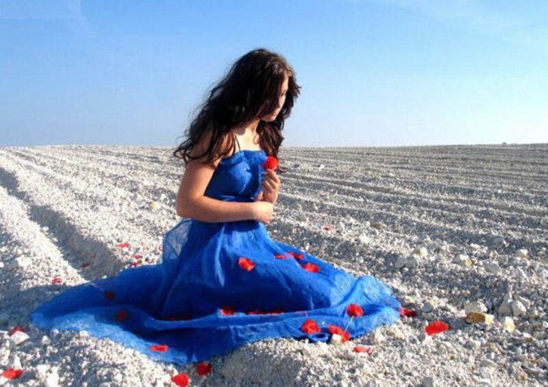 Woman in blue dress on salt flats