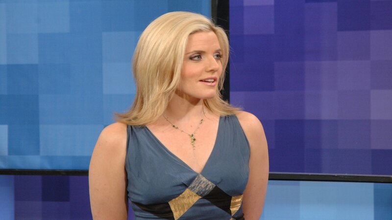 woman in blue dress on set