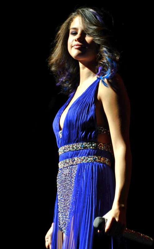 woman in blue dress on stage