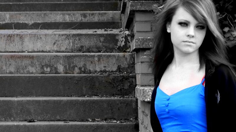 woman in blue dress on stairs