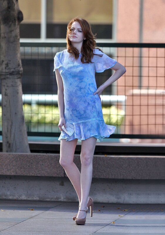 woman in blue dress on street