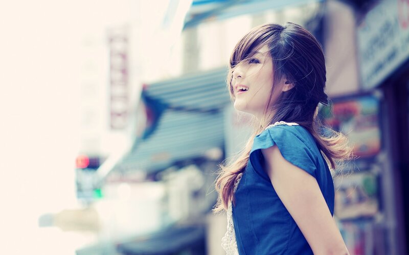 woman in blue dress on street