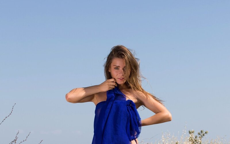 woman in blue dress outdoors