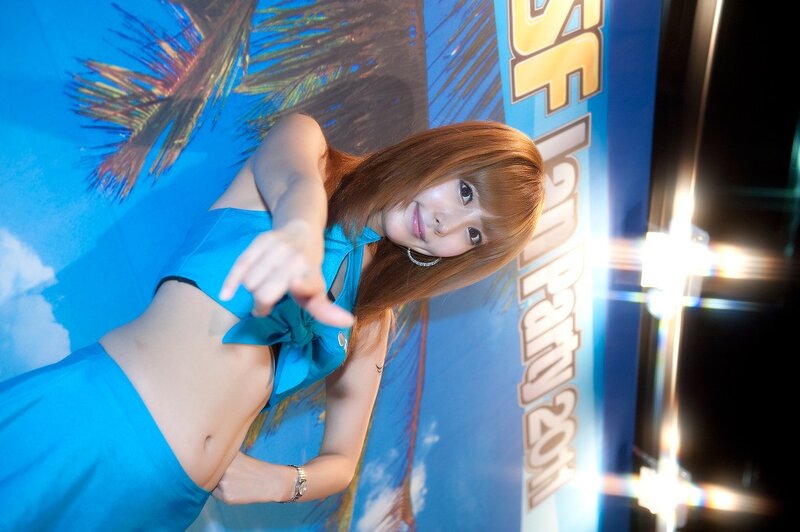 woman in blue dress pointing