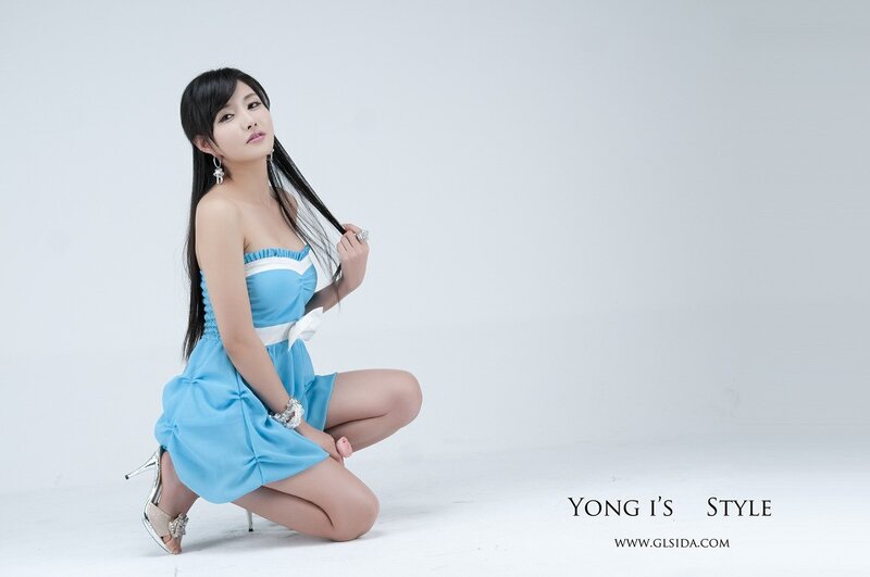 woman in blue dress posing