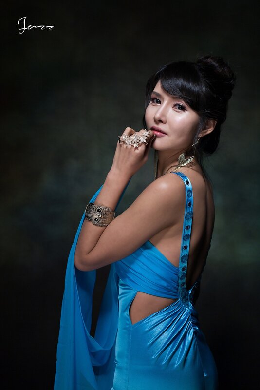 woman in blue dress posing