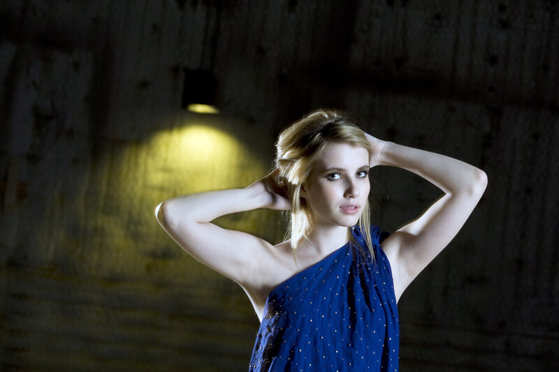 woman in blue dress posing