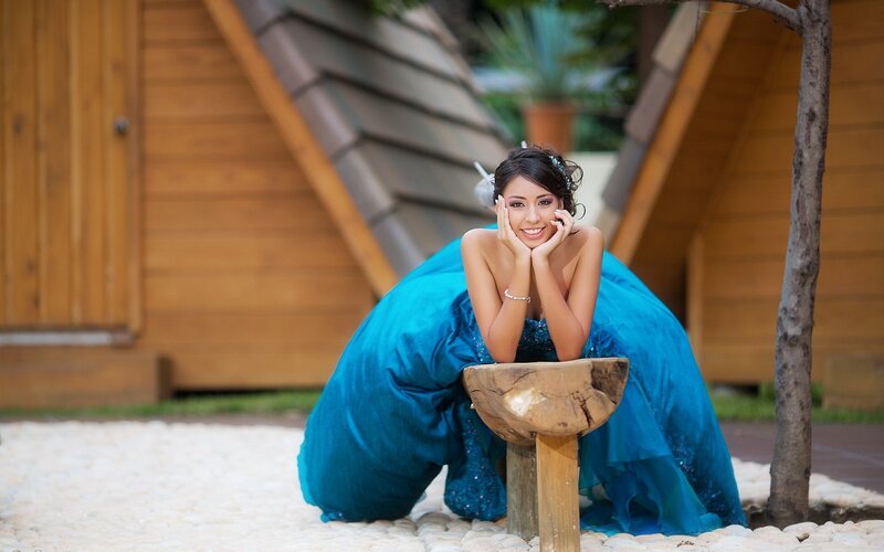 woman in blue dress posing