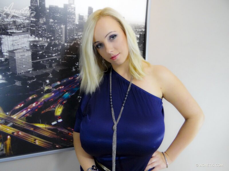 Woman in blue dress posing