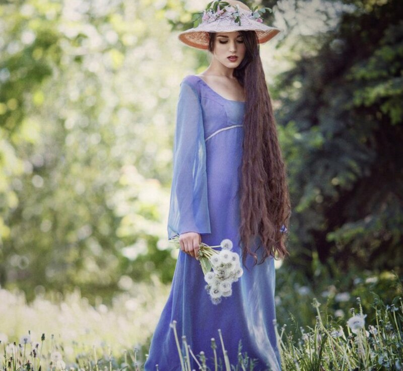 Woman in Blue Dress — Serene, Afternoon, Photograph, Hat, Flowers