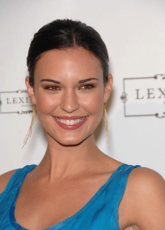 woman in blue dress smiling